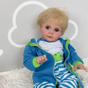 Lifelike 60cm Reborn Toddler Maddie doll with blue hoodie on white fur rug