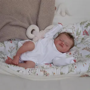Realistic 48cm reborn baby doll Rosalie sleeping in white bodysuit on soft blanket