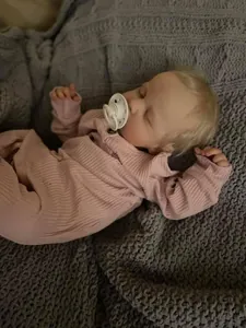 Macro detail of LouLou reborn doll showing realistic 3D skin texture and veins