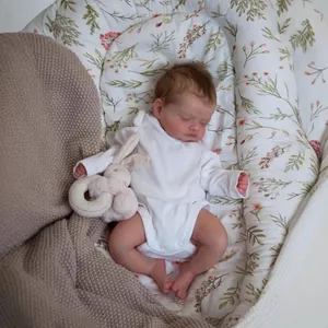 Realistic 48cm reborn baby doll Rosalie in white romper with plush bunny and bed