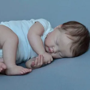Realistic 19-inch sleeping reborn baby doll Ashia in a white sleeveless bodysuit