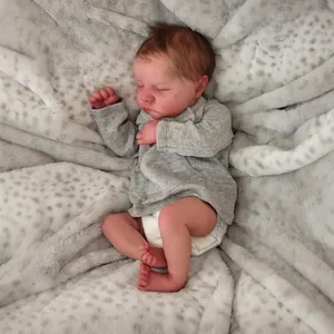Lifelike 19-inch sleeping reborn baby doll in grey long-sleeve top and white diaper