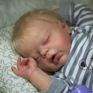 Reborn baby doll 55cm sleeping in striped outfit with pacifier accessory