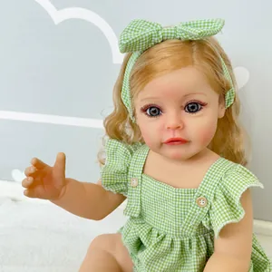 55cm realistic reborn baby doll with blonde hair and green plaid dress on white fur