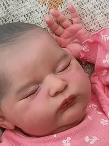 Close-up of 20 inch reborn baby doll with visible 3D skin veins and realistic eyelashes