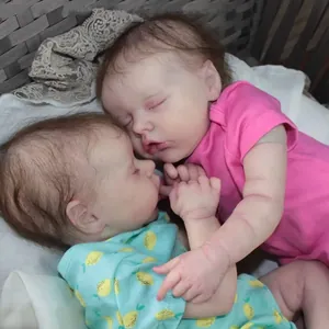 Twin A and B 18-inch realistic sleeping reborn baby dolls in pink and blue outfits