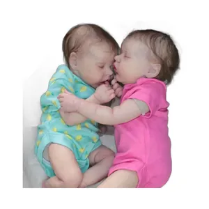 Realistic 18-inch Twin A and Twin B reborn baby dolls set in green and pink onesies