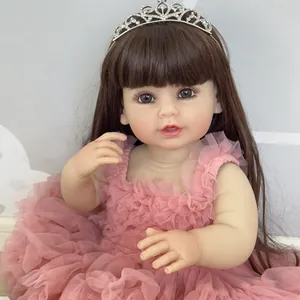 Bambola Reborn NPK in abito di pizzo rosa con corona di strass e lunghi capelli castani