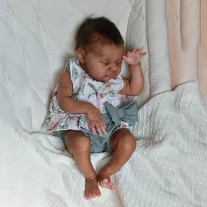 Realistic 20-inch newborn baby doll with 3D skin texture and floral outfit