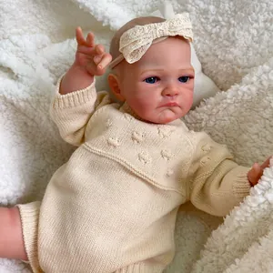 Lifelike 20-inch Reborn baby doll with visible veins in beige knitted romper and lace headband
