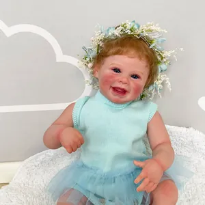 50cm realistic reborn baby doll Harper with blue knit top and floral headband