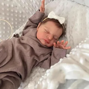 20 inch lifelike reborn baby doll Laura in knitted outfit sleeping on a soft blanket