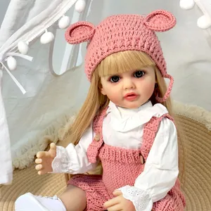 Ρεαλιστική κούκλα Reborn 55cm Betty με ξανθά μαλλιά, ροζ πλεκτά ρούχα και σκουφάκι αρκουδάκι