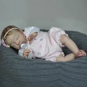 19-inch lifelike newborn reborn baby doll August sleeping in a pink cat outfit and headband