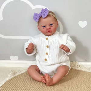 50cm handmade reborn baby doll with blue eyes in white knitted outfit and purple headband