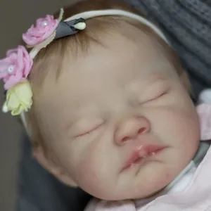 Realistic 19-inch reborn sleeping baby doll August with floral headband and soft skin