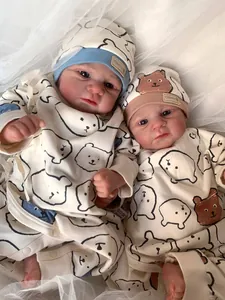 Macro detail of lifelike Elijah reborn doll skin texture and cute bear print outfit