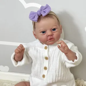 Handcrafted 50cm realistic reborn baby doll in white knit sweater with purple bow headband