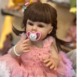 Lifelike 55cm silicone reborn baby doll with pink lace dress and cat pacifier