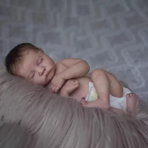 Realistic 49cm reborn baby doll Levi sleeping on plush mat with hand-rooted hair