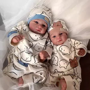 Realistic newborn baby Elijah doll in white cotton bear print romper and hat set