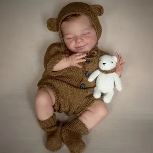 Realistic 49cm sleeping reborn baby doll April in brown knit outfit with small bear toy