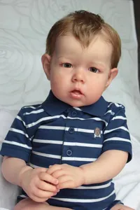 Detail of Liam reborn baby doll wearing a blue striped polo shirt with realistic 3D skin texture