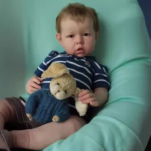 Lifelike 75cm Reborn Liam baby doll with 3D skin texture in blue polo and shorts