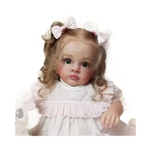 Lifelike reborn toddler doll with brown curly hair and lace white dress on white background