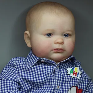 Lifelike 60cm Joseph reborn baby boy doll wearing a blue and white checkered shirt