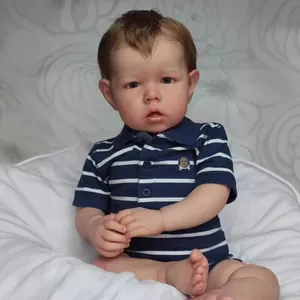 75cm Liam reborn baby doll with 3D skin and blue polo shirt in sitting pose