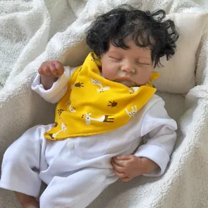 Reborn baby doll Levi Awake with realistic skin texture and curly hair in yellow bib