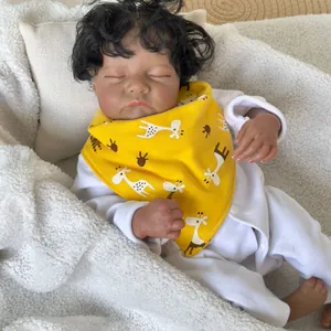 Realistic 49cm reborn baby doll Levi Awake with rooted hair in a giraffe bib