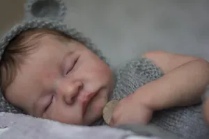 Macro close-up of 19 inch realistic reborn baby Levi with 3D skin and knit hat