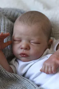 Close-up of realistic newborn reborn doll with detailed skin texture and eyelashes