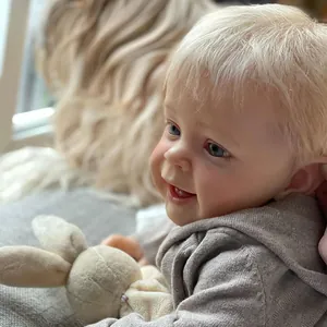 Lifelike 24-inch reborn baby boy Yannik with blond hair and gray knit sweater