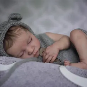 Lifelike 19 inch Levi reborn doll with 3D skin texture in a grey knitted outfit