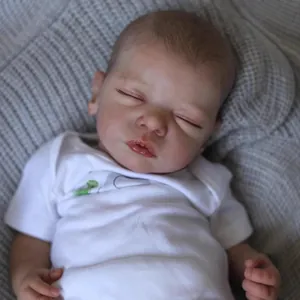 48cm realistic sleeping reborn baby doll in white bodysuit on gray knitted blanket