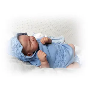 Realistic 48cm newborn reborn doll in blue knit outfit sleeping on a soft white blanket