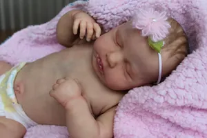 Close-up detail of realistic 49cm newborn reborn doll with lifelike skin texture and veins