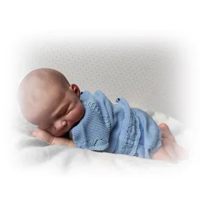 Realistic 48cm reborn baby doll in light blue knit outfit sleeping on white fabric