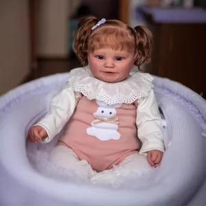 Realistic 60cm Maddie reborn baby doll with blonde pigtails and pink rabbit outfit