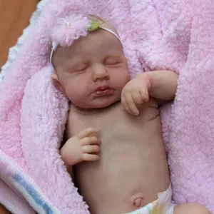 Realistic 49cm newborn reborn doll sleeping in pink blanket with flower headband