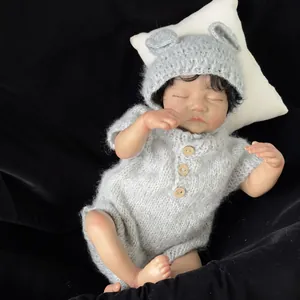 Realistic 19 inch Levi reborn baby doll with brown skin in gray knitted outfit