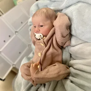 Realistic 49cm reborn baby Levi doll with 3D skin texture in brown knit romper