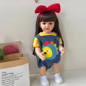 55cm realistic reborn baby doll with brown hair, yellow t-shirt and blue denim overalls