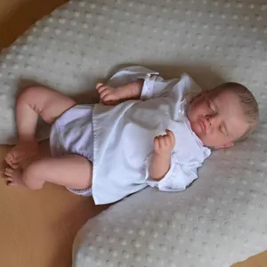 Lifelike 49cm Rosalie newborn reborn doll with 3D skin sleeping on a gray cushion