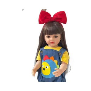 Lifelike 55cm baby doll with brown hair, red bow, and blue denim overall shorts