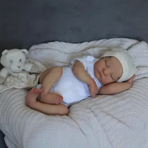 Lifelike 19 inch reborn baby doll Levi with 3D skin texture in white onesie and knit hat