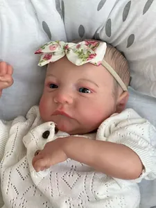Detailed close-up of 49cm reborn doll with realistic 3D skin veins and hand-painted hair